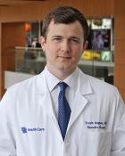 Headshot of Dr. Travis Hughes